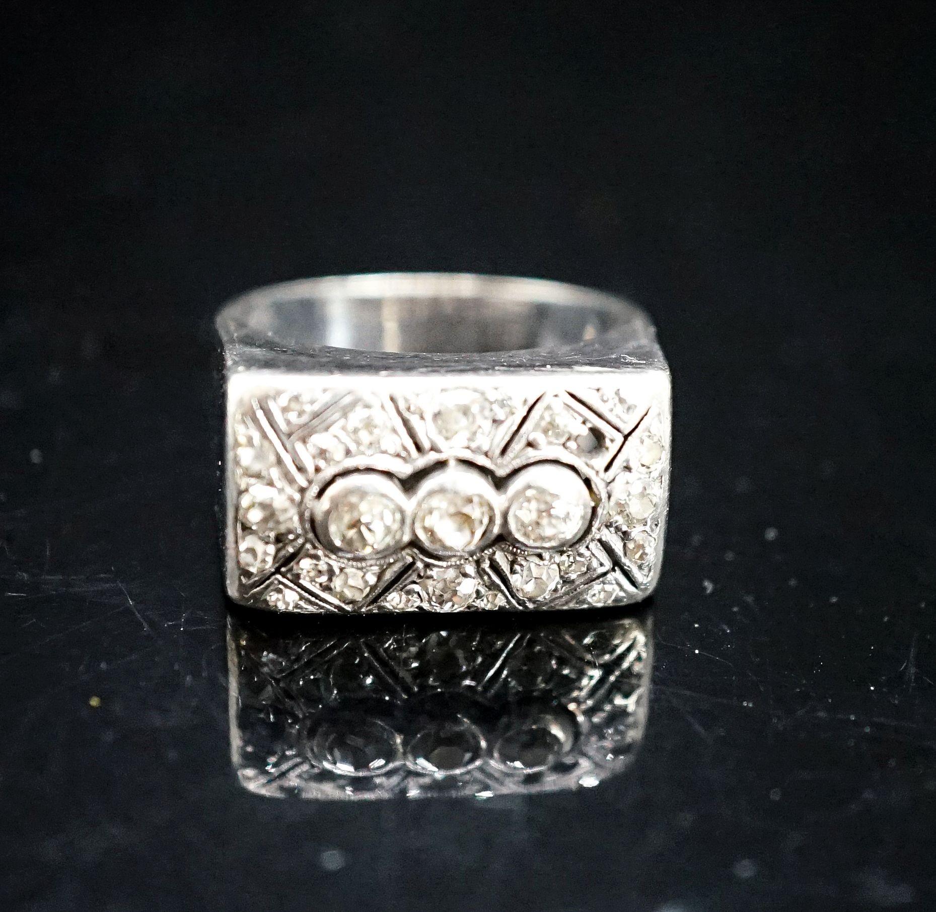 A 585 white metal and diamond cluster set tablet ring (stone missing), size N/O, gross 8.1 grams.